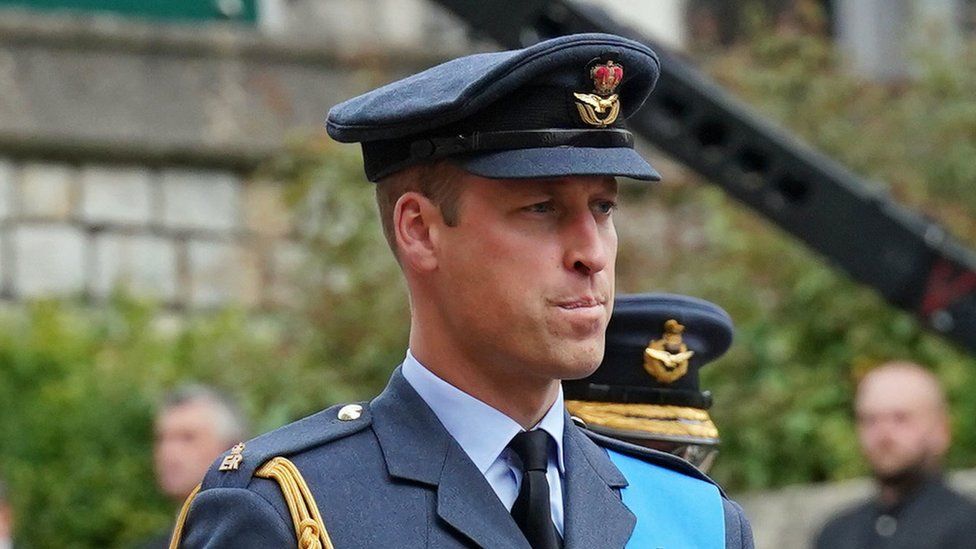 The Prince of Wales looks solemn as he wears military uniform
